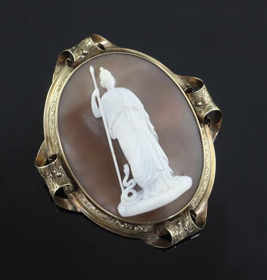 A Victorian engraved gold mounted oval cameo pendant brooch, carved with Pallas Athena and the serpent Erichthonius, 72mm.